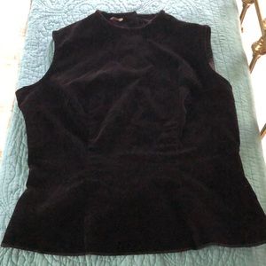 Velvety sleeveless top, buttons up back.